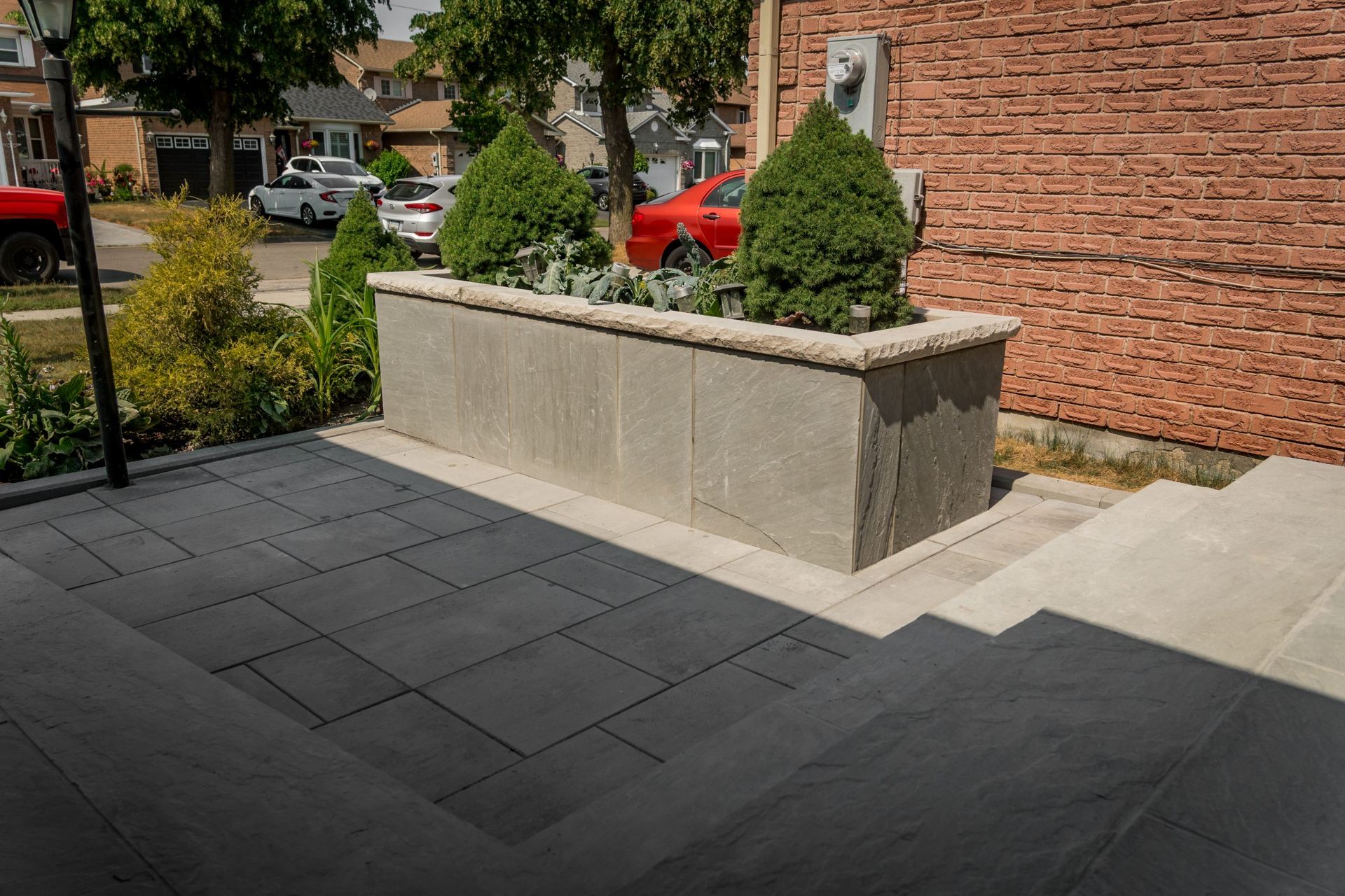 Front walkway and stone planter by NR Builds